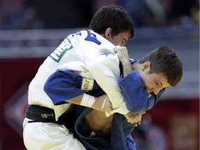 Arthur Margelidon (blue) of Canada competes against Tommy Macias (white) of Sweden two weeks ago in the Grand Slam Osaka at Maruzen Intec Arena Osaka in Japan.