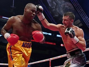 Oleksandr Gvozdyk punches Adonis Stevenson during their WBC light heavyweight championship fight at the Videotron Centre on Dec. 1, 2018, in Quebec City.