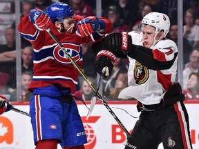 Michael Chaput of the Montreal Canadiens and Brady Tkachuk of the Ottawa Senators rough each other up at the Bell Centre on Dec. 4, 2018, in Montreal.