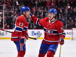 The Canadiens’ Max Domi (left) celebrates with linemate Jonathan Drouin after scoring goal during second period of NHL game against the Ottawa Senators at the Bell Centre in Montreal on Dec. 4, 2018.