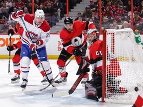 Senators goalie Craig Anderson follows the puck as teammate Cody Ceci defends against Nicolas Deslauriers of the Montreal Canadiens in the first period at Canadian Tire Centre on Dec. 6, 2018 in Ottawa.