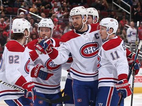 Shea Weber of the Montreal Canadiens celebrates with Jonathan Drouin (92), Max Domi (13) and Brendan Gallagher (11) after scoring a power-play goal against the Arizona Coyotes during the second period at Gila River Arena on Dec. 20, 2018 in Glendale, Ariz.
