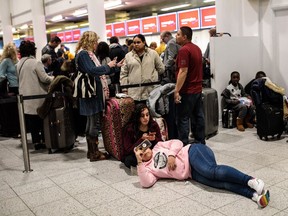 LONDON, ENGLAND - DECEMBER 21: Passengers wait in the South Terminal building at London Gatwick Airport after flights resumed today on December 21, 2018 in London, England. Authorities at Gatwick have reopened the runway after drones were spotted over the airport on the night of December 19. The shutdown sparked a succession of delays and diversions in the run up to the Christmas getaway, in what authorities have called a "deliberate act" to disrupt the airport. Police continue their search for the drone operators responsible.