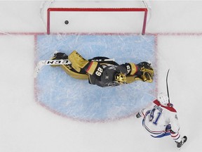 Canadiens' Paul Byron  scores a goal against Marc-André Fleury of the Vegas Golden Knights in overtime to win their game 4-3 on Saturday, Dec. 22, 2018, in Las Vegas.