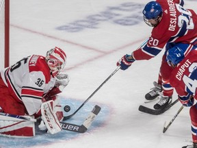 Carolina Hurricanes goaltender Curtis McElhinney (35) stops Montreal Canadiens left wing Nicolas Deslauriers (20) during 3rd period NHL action at the Bell Centre in Montreal, on Tuesday, November 27, 2018.