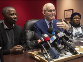 Lawyer Jean-Pierre Ménard, centre, speaks to reporters two weeks ago flanked by mother Evelyne Mavoungou-Tsonga and father Jean-Claude Moukoko.