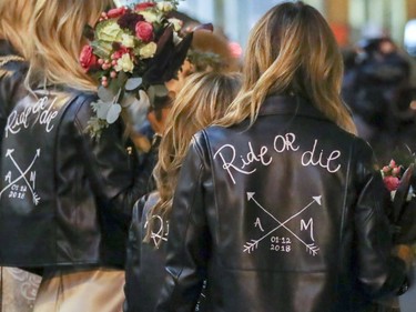 Women in the bridal party wear custom leather jackets to the wedding of Hells Angel member Martin Robert to Annie Arbic in Montreal on Saturday, Dec. 1, 2018.