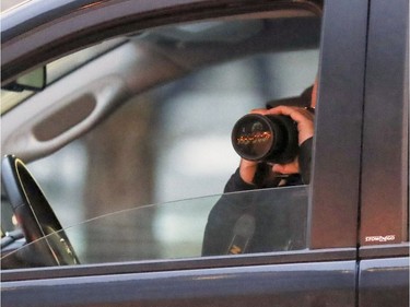 Police take photos of guests arriving for the wedding of Hells Angel member Martin Robert to Annie Arbic in Montreal on Saturday, Dec. 1, 2018.
