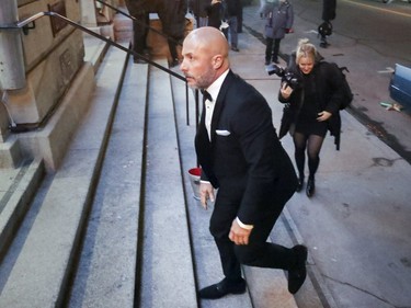 Hells Angel member Martin Robert mounts the steps of Le Windsor for his wedding to Annie Arbic in Montreal on Saturday, Dec. 1, 2018.