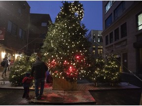 Montrealers get a look at the new Vilain Sapin on Monday, Dec. 3, 2018. The "ugly ticklish tree" is on display at the corner of Prince-Arthur and St Dominique Sts.