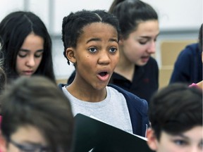 Dali Tshuma keeps pace with her choir mates from Les petits chanteurs de Laval at a recent rehearsal in Laval.