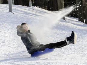 Marianne Chevre, visiting from Paris, france, kicks up some snow while toboganning for the first time in her life on Mount Royal.