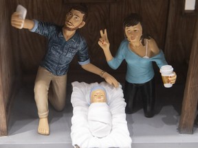 The Nativity scene, which features modern day equipped Joseph taking a selfie, with Mary drinking coffee from disposable cup are on display at St Joseph's Oratory museum on Monday December 10, 2018.