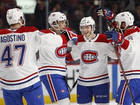 Canadiens players celebrate after Jeff Petry's goal during 6-4 win over the Carolina Hurricanes at the Bell Centre in Montreal on Dec. 13, 2018.