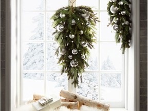 Elaborately decorating a picture window, fireplace mantel or other focal points in a room can produce big holiday decor impact without having a tree in a small space.