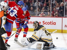 Bruins' Jaroslav Halak makes a save as Canadiens' Max Domi and Andrew Shaw look for the rebound Monday night at the Bell Centre.