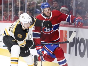 Jakob Forsbacka Karlsson rides Michael Chaput into the boards during first period in Montreal Monday, Dec. 17, 2018.