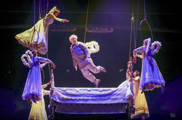 Angels lift Mauro from his deathbed high above the stage during opening night performance of Cirque du Soleil's Corteo in Montreal Dec. 19, 2018.