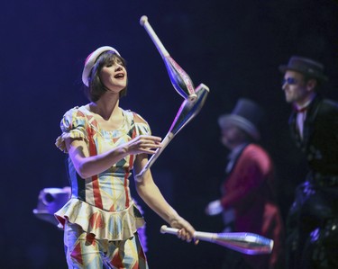 A chorus member sings and juggles during opening night performance of Cirque du Soleil's Corteo in Montreal Dec. 19, 2018.