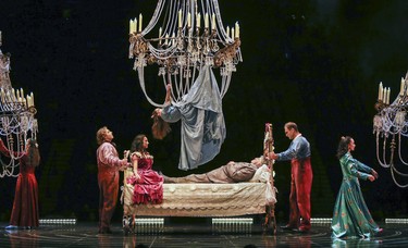 Former lovers descend from chandeliers to visit Mauro on his deathbed during opening night performance of Cirque du Soleil's Corteo in Montreal Dec. 19, 2018.