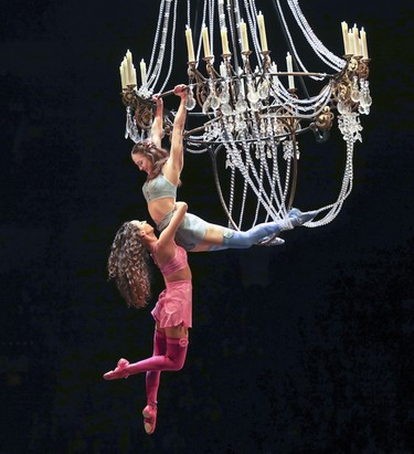 Acrobats signifying dead clown Mauro's former lovers swing from the chandelier during opening night performance of Cirque du Soleil's Corteo in Montreal Dec. 19, 2018.