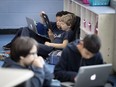 Max Maxwell, left, and Harry Shakeshaft use alternative seating in their Grade 5 class at Edinburgh School in Montreal in 2018.