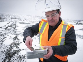 The asbestos project will be a major economic boon for the Eastern Townships and a triple win for the environment, says AMI president and founder Joël Fournier. Here, AMI plant manager Remi Belliveau holds processed lizardite extracted from asbestos mine tailings in Danville, QC.