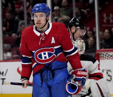 Montreal Canadiens right wing Brendan Gallagher tries to shake it off after having his head driven into the ice by New Jersey Devils defenseman Ben Lovejoy. I was shocked by how hard the hit to Gally was, and that one person came to help him up from the ice, which took some time. He skated back to the bench unaided.