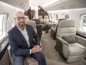 Bombardier's industrial design supervisor Alexandre Curthelet shows the company's new jetliner, the Global 7500, the longest-range business jet in the world at the company's finishing plant in Montreal, Wednesday, Dec. 19, 2018.