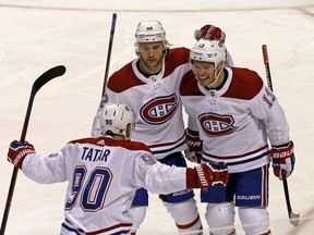 Montreal Canadiens left wing Tomas Tatar celebrates his third-period goal with teammates Jonathan Drouin, centre, and Max Domi in a game against the Florida Panthers on Friday, Dec. 28, 2018 in Sunrise, Fla.