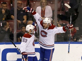 Montreal Canadiens left wing Nicolas Deslauriers (20) celebrates his first-period goal with Victor Mete (53) during an NHL hockey game against the Florida Panthers, Friday, Dec. 28, 2018, in Sunrise, Fla.