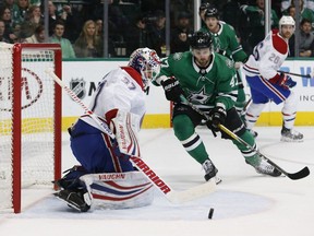 Canadiens goaltender Antti Niemi makes a save as Dallas Stars' Alexander Radulov watches the rebound during the first period of an NHL hockey game in Dallas on Monday, Dec. 31, 2018.