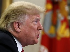 President Donald Trump speaks to members of the five branches of the military by video conference on Christmas Day, Tuesday, Dec. 25, 2018, in the Oval Office of the White House. The military members were stationed in Guam, Qatar, Alaska, and two groups in Bahrain.