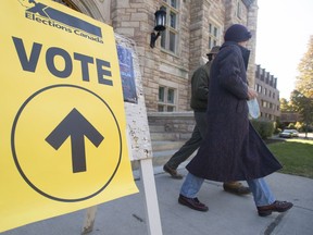 Voters leave a polling station in the Montreal riding of NDG-Westmount on election day, Monday, October 19, 2015.