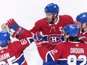 Montreal Canadiens' Shea Weber (6) celebrates with teammates Andrew Shaw (65), Jonathan Drouin (92) and Brett Kulak after scoring against the New York Rangers during first period in Montreal on Dec. 1, 2018.
