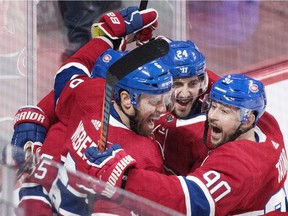 Canadiens' Shea Weber (6) celebrates with teammates Phillip Danault (24) and Tomas Tatar after scoring against the Ottawa Senators in Montreal on Saturday, Dec. 15, 2018.