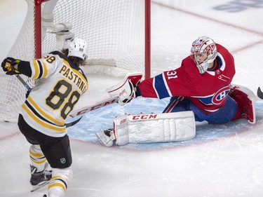 Carey Price stops right wing David Pastrnak (88) during second period in Montreal Monday, Dec. 17, 2018.