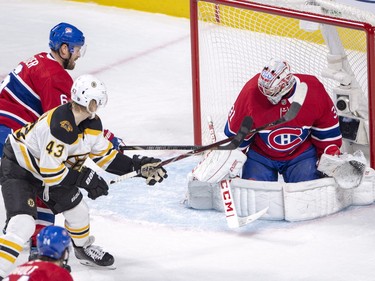 Carey Price stops Boston Bruins centre Danton Heinen as Habs defenceman Shea Weber moves in during first period in Montreal on Monday, Dec. 17, 2018.