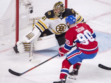 Jaroslav Halak stops left wing Tomas Tatar during first period in Montreal, Monday, Dec. 17, 2018.