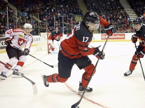 Team Canada's Nick Suzuki controls the puck during second period action against Team Switzerland in an exhibition game in Victoria, B.C., on Wednesday, December 19, 2018. Canada won 5-3.