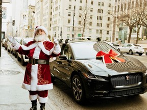 Dapper Santa Claus arrives at the Ritz-Carlton Montreal holiday benefit spectacular in the all-electric Jaguar I-PACE, with loads of toys from JRC and Mega Bloks.