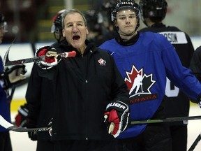 Team Canada head coach Tim Hunter runs through drills during selection camp at the Q Centre in Victoria, B.C., on Tuesday, December 11, 2018. (THE CANADIAN PRESS/Chad Hipolito)