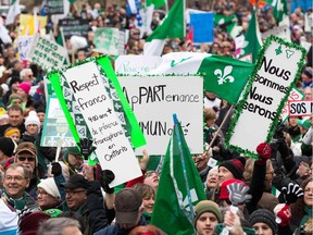 Canadian Francophones rally in front of the Human Rights building during the Franco-Ontario Day of Action in Ottawa, Ontario on December 1, 2018. - Thousands of Francophones demonstrated across Ontario to protest against the decision of the government of this province, the richest and most populous in Canada, to cancel the construction of a first university entirely in French. Franco-Ontarians gathered in about 40 cities in the province, including some 3,500 demonstrators in Ottawa, the federal capital, and a few hundred in Toronto, according to organizers.