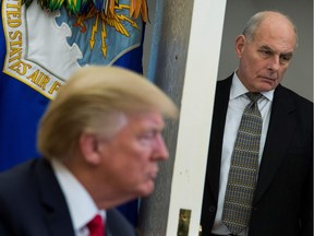 (FILES) In this file photo taken on February 02, 2018, White House Chief of Staff John Kelly looks on as US President Donald Trump meets with North Korean defectors in the Oval Office at the White House in Washington, DC. - US President Donald Trump on Saturday, December 8, 2018, announced his chief of staff John Kelly would be leaving the administration at the end of the year -- the latest in a series of moves by the Republican leader to change his inner circle of aides.