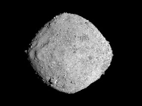 This Nov. 16, 2018, image provide by NASA shows the asteroid Bennu. After a two-year chase, a NASA spacecraft has arrived at the ancient asteroid Bennu, its first visitor in billions of years. The robotic explorer Osiris-Rex pulled within 12 miles (19 kilometres) of the diamond-shaped space rock Monday, Dec. 3. The image, which was taken by the PolyCam camera, shows Bennu at 300 pixels and has been stretched to increase contrast between highlights and shadows. (NASA/Goddard/University of Arizona via AP)