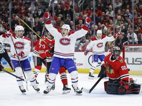 Canadiens' Andrew Shaw, centre, reacts to a goal scored by Max Domi, second left, against Chicago Blackhawks goaltender Corey Crawford on Sunday, Dec. 9, 2018, in Chicago.