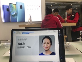 A profile of Huawei's chief financial officer Meng Wanzhou is displayed on a Huawei computer at a Huawei store in Beijing, China, Thursday, Dec. 6, 2018. Canadian authorities said Wednesday that they have arrested Meng for possible extradition to the United States.