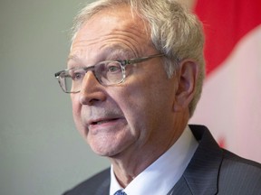 New Brunswick Progressive Conservative Leader Blaine Higgs answers questions from the media at Government House in Fredericton on Friday, Nov. 2, 2018. The premier of New Brunswick says the level of transfer payments to the provinces could be at risk if a pipeline isn't built to move western crude to Eastern Canada and foreign markets.