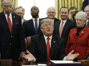 U.S. President Donald Trump participates in a signing ceremony for the "Juvenile Justice Reform Act" in the Oval Office of the White House on Friday, Dec. 21, 2018, in Washington.