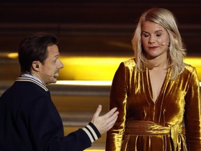In this photo taken Monday, Dec. 3, 2018, French DJ and musician Martin Solveig, left, talks to Olympique Lyonnais' Ada Hegerberg, of Norway, during the Golden Ball (Ballon d'Or) award ceremony at the Grand Palais in Paris. After asking the first woman to win the Ballon d'Or if she twerked, French DJ Martin Solveig then apologized.